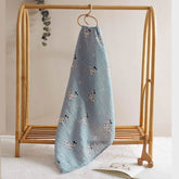 Dalmatians print muslin baby swaddle hanging from wooden peg